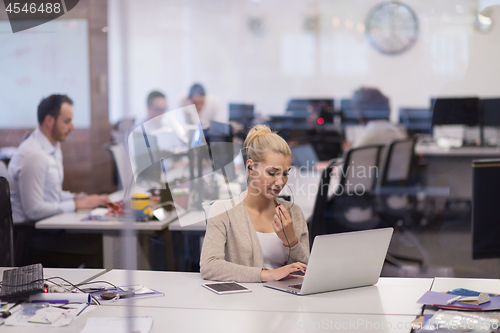 Image of businesswoman using a laptop in startup office