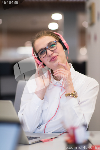 Image of businesswoman using a laptop in startup office