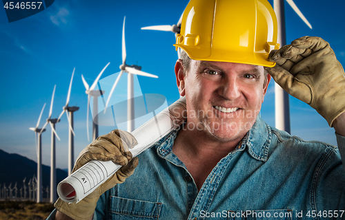 Image of Smiling Contractor in Hard Hat Holding Extention Cord Outdoors N