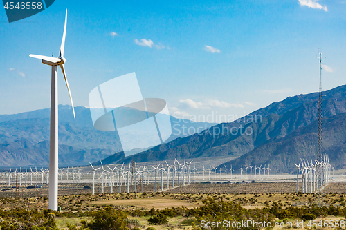 Image of Dramatic Wind Turbine Farm in the Desert of California.