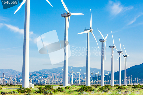 Image of Dramatic Wind Turbine Farm in the Desert of California.