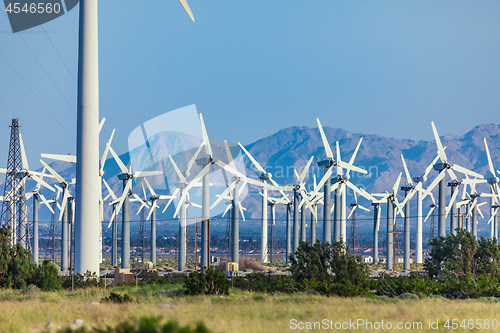 Image of Dramatic Wind Turbine Farm in the Desert of California.
