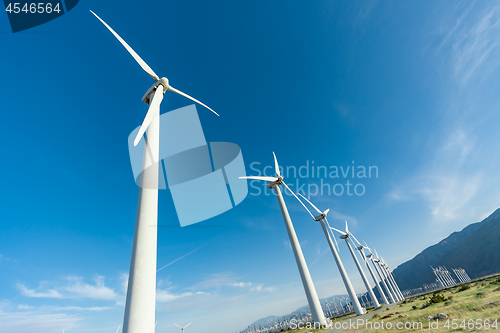 Image of Dramatic Wind Turbine Farm in the Desert of California.