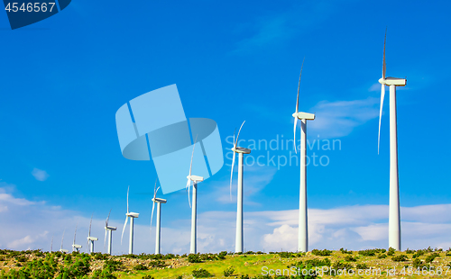 Image of Dramatic Wind Turbine Farm in the Desert of California.