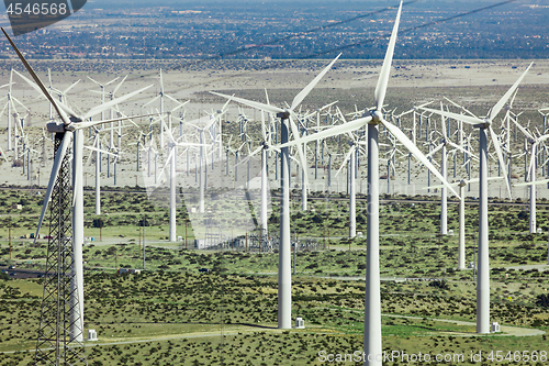 Image of Dramatic Wind Turbine Farm in the Desert of California.