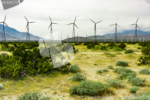 Image of Dramatic Wind Turbine Farm in the Desert of California.