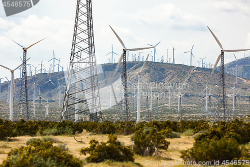 Image of Dramatic Wind Turbine Farm in the Desert of California.