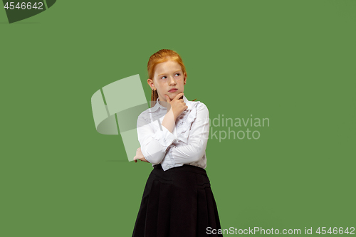 Image of Young serious thoughtful teen girl. Doubt concept.