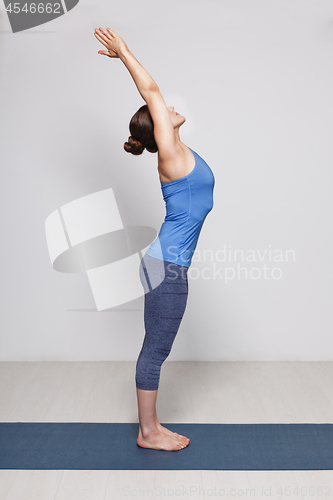 Image of Woman doing Hatha Yoga asana Tadasana