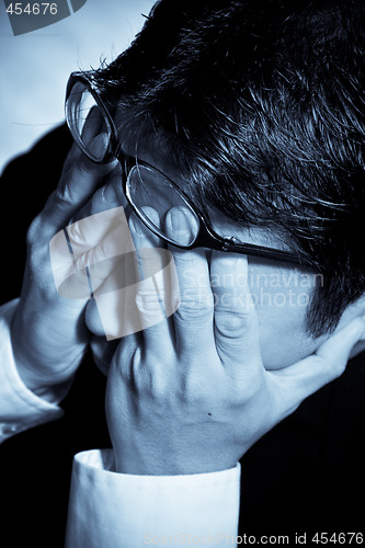 Image of Stressed businessman