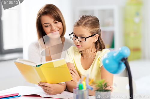 Image of mother and daughter doing homework together