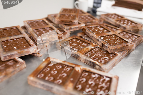 Image of chocolate in candy molds at confectionery shop