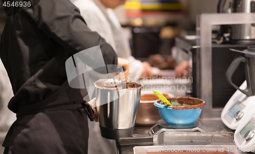 Image of chef making chocolate at confectionery shop