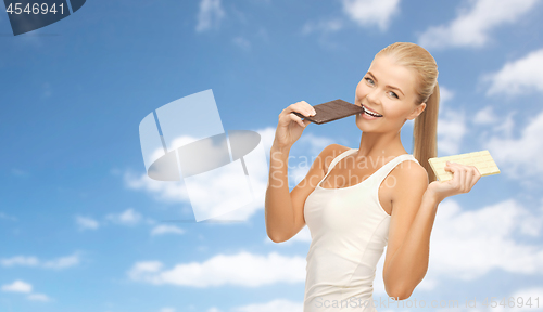 Image of happy woman eating dark chocolate instead of white