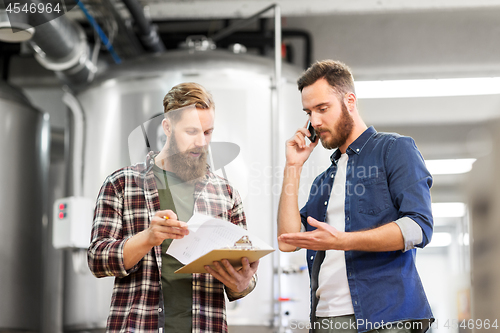 Image of men working at craft brewery or beer plant