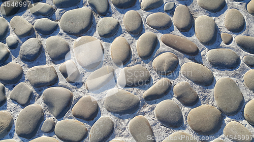 Image of Road paved with large stones, stone pavement, texture of the sto