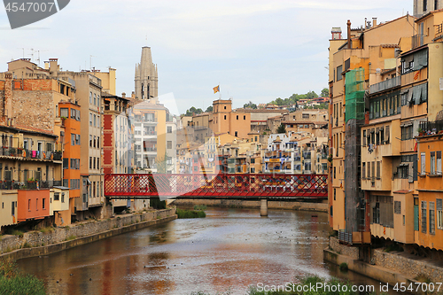 Image of Colorful houses and Eiffel bridge on river Onyar in Girona