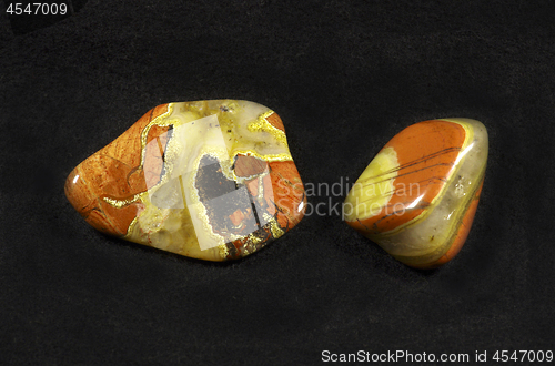 Image of Polished stones of Jasper on black background