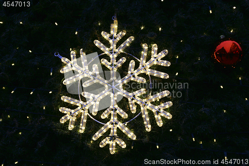 Image of Beautiful christmas decoration, bright glowing snowflake