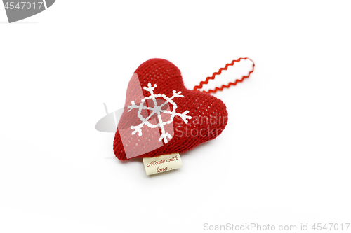 Image of Red warm knitted heart isolated on white background