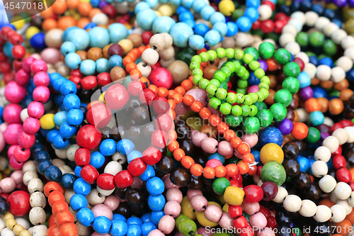 Image of Colorful handmade wooden bracelets, close-up background