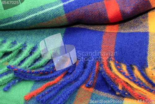 Image of Texture of a bright multicolor scarf with fringe