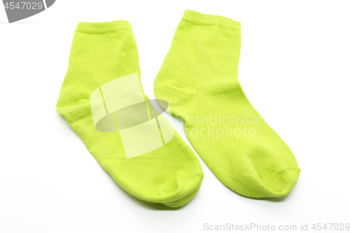 Image of Pair of lime color socks isolated on white