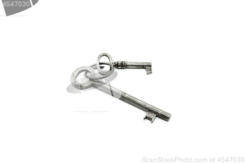 Image of Two very old keys on white background