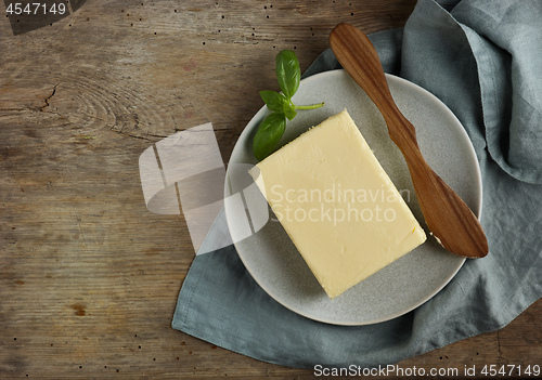 Image of butter on old wooden table