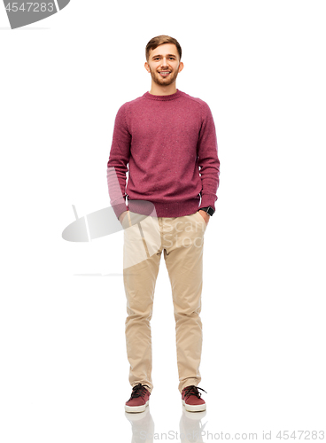 Image of smiling young man over white background