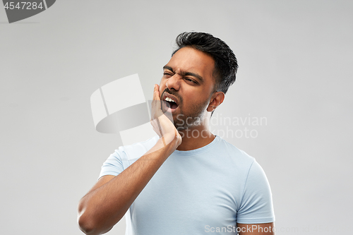 Image of indian man suffering from toothache