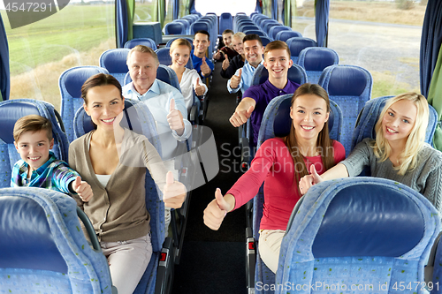 Image of group of happy passengers travelling by bus