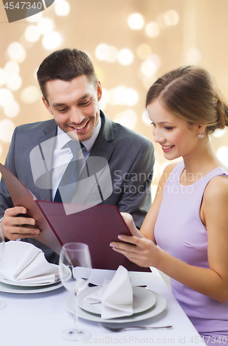 Image of couple with menu at restaurant