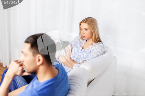 Image of unhappy couple having argument at home