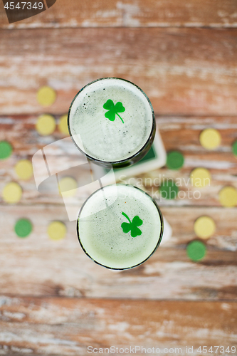 Image of glasses of green beer with shamrock from top