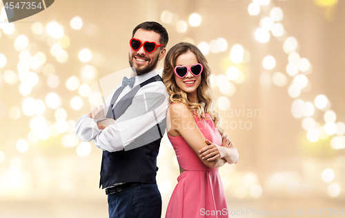 Image of happy couple in heart-shaped sunglasses