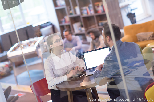 Image of Business team Working With laptop in creative office