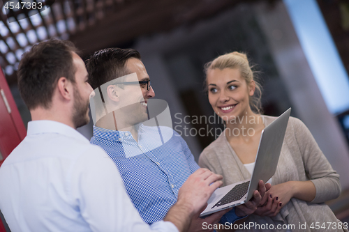 Image of Business team Working With laptop in creative office