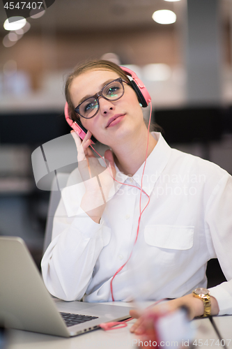 Image of businesswoman using a laptop in startup office