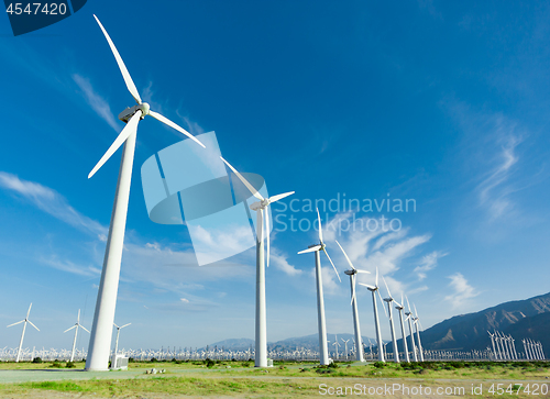 Image of Dramatic Wind Turbine Farm in the Desert of California.