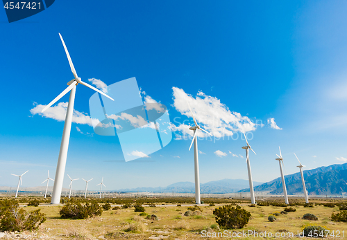 Image of Dramatic Wind Turbine Farm in the Desert of California.