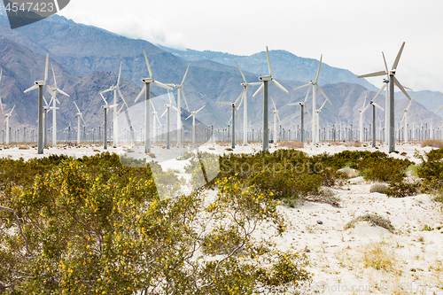 Image of Dramatic Wind Turbine Farm in the Desert of California.