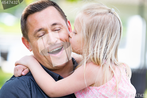 Image of Young Caucasian Father and Daughter Having Fun At The Park