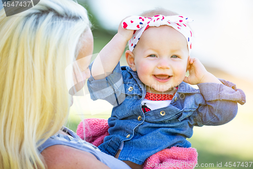 Image of Young Caucasian Mother and Daughter At The Park