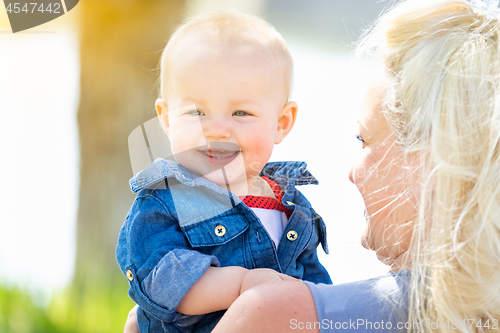 Image of Young Caucasian Mother and Daughter At The Park