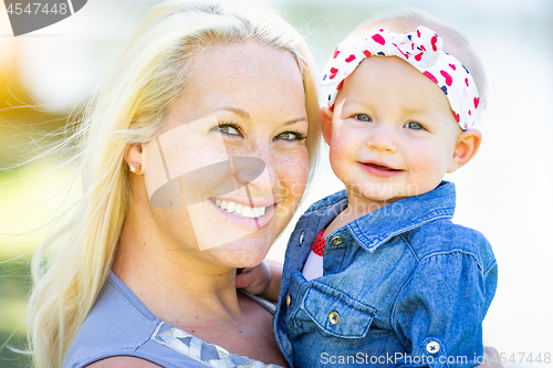 Image of Young Caucasian Mother and Daughter At The Park