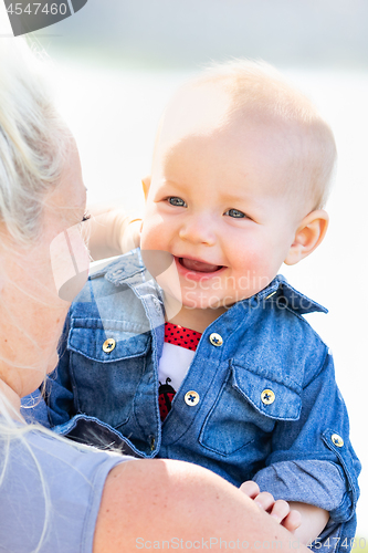 Image of Young Caucasian Mother and Daughter At The Park