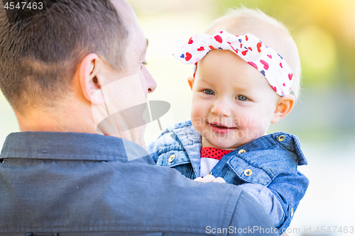 Image of Young Caucasian Father and Baby Girl At The Park