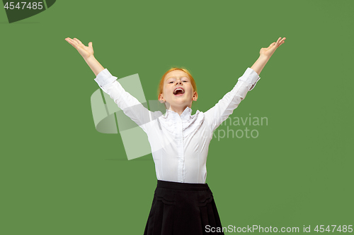 Image of Winning success teen girl happy ecstatic celebrating being a winner. Dynamic energetic image of female model