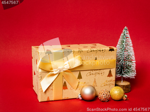 Image of Christmas decoration gift box with red background